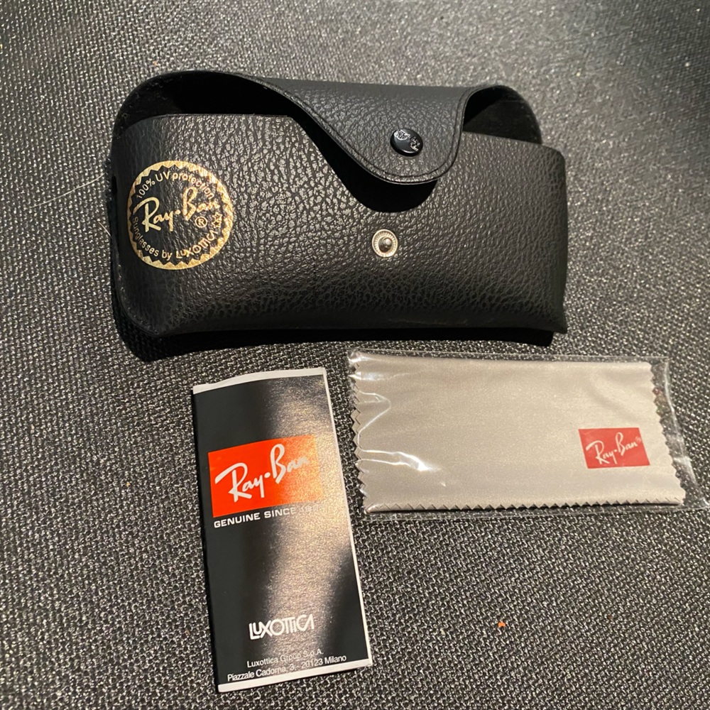 Ray-Ban Sunglasses case. Black w snap closure. Cleaning cloth included.
